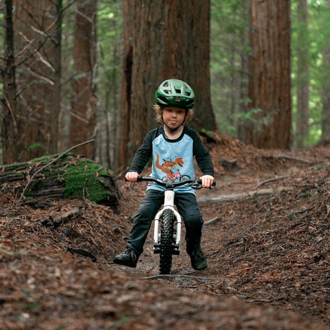 Kid riding shop balance bike